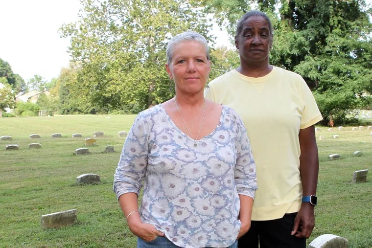 Holly Olson, (L) a member of the Middletown Friends Meeting and Brenda Cowan (R) a local resident of Langhorne, are committee members organizing a memorial service for the forgotten slaves buried on the site, Langhorne, PA,