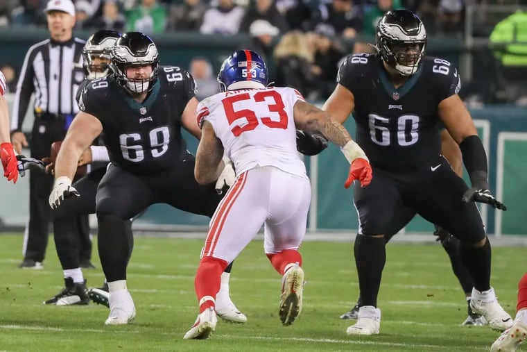 Eagles guard Landon Dickerson (69) and tackle Jordan Mailata during the victory against the New York Giants at Lincoln Financial Field on Jan. 8.