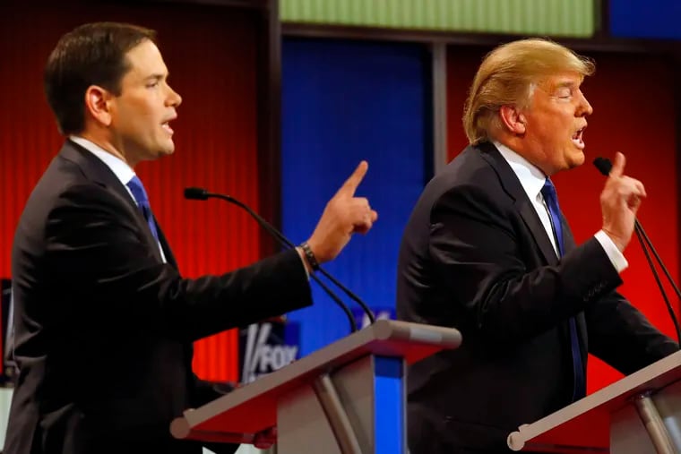 Sen. Marco Rubio (left) and Donald Trump argue during the Republican debate at the Fox Theatre in Detroit. Rubio said the billionaire businessman had &quot;basically mocked everybody&quot; over the last year.