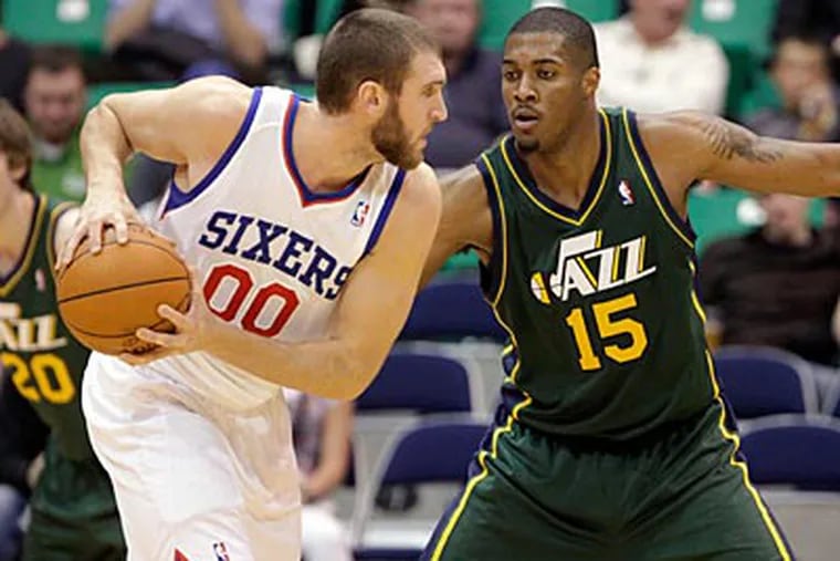 Two games into the season, Spencer Hawes was averaging a team-high six assists per game. (Jim Urquhart/AP)