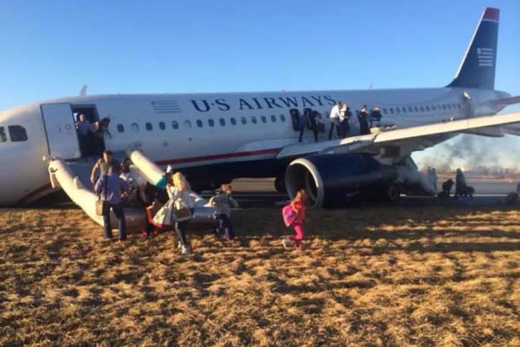 A plane skidded off the runway at PHL after a botched takeoff. This photo of the event was posted on Facebook.