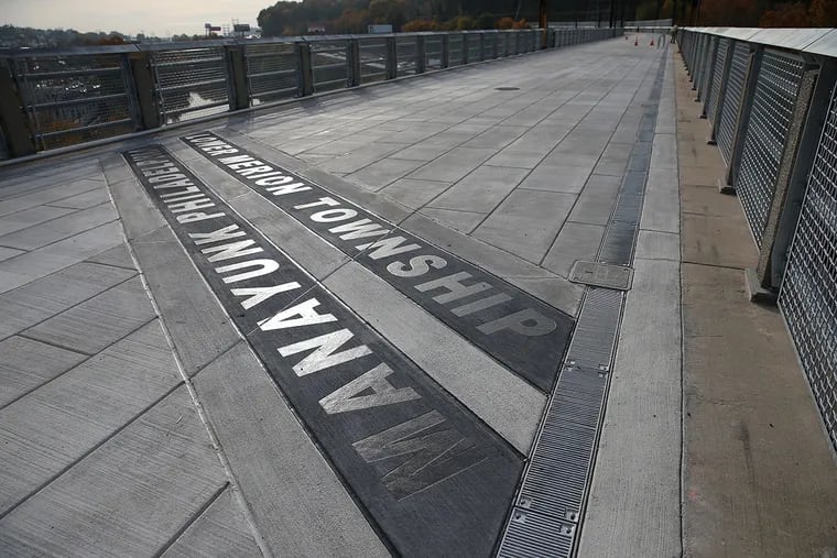 The Manayunk Bridge is reopening as a pedestrian and bike throughway on Friday. The lines on the bridge shows the boundary between Philadelphia and Lower Merion on October 27, 2015.