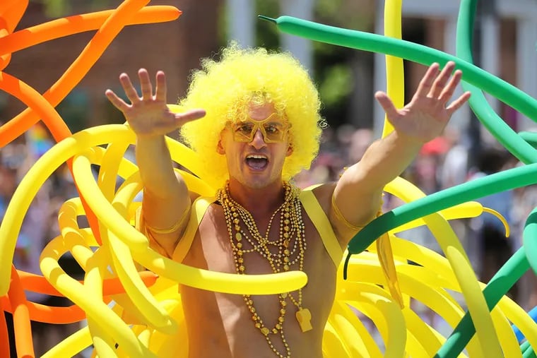 Jerome Kurtenbach, of the Philadelphia Gay Chorus, performs for the judges on Market Street during the Gay Pride Parade on Sunday.