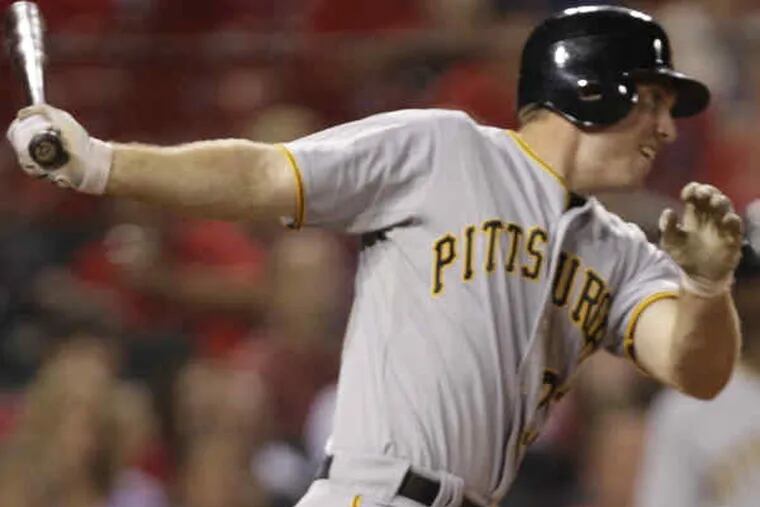 Pittsburgh's John Bowker hits a three-run double as the Bucs won only their 16th road game on Tuesday.