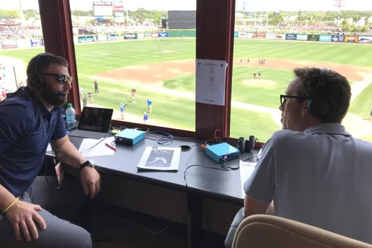 Kevin Frandsen (left), one of three new analysts to join the Phillies’ radio broadcasts this season, calls a spring training game alongside play-by-play announcer Scott Franzke.