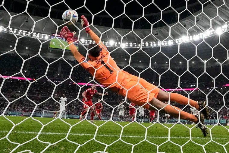 U.S. goalkeeper Matt Turner dove at full stretch to try to stop Gareth Bale's penalty kick, but he couldn't get there.