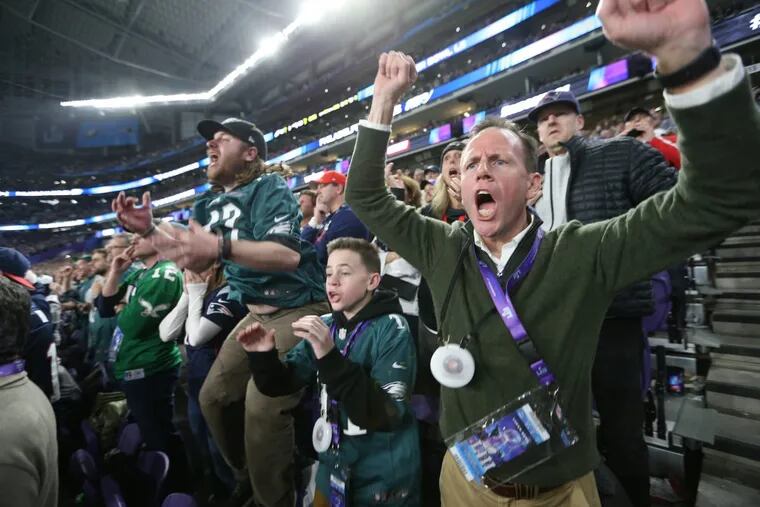 Dave and his Son Kevin Greed, react to an Eagles win over the Patriots at the Super Bowl LII, at U.S. Bank Stadium in Minneapolis, Minnesota, Sunday, Feb. 4, 2018.