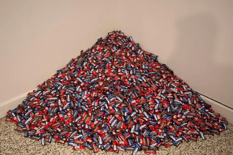 "do it" exhibition at Moore College of Art & Design is a 180-pound pile of Peanut Chews, deposited in a corner per instructions from the late American artist Felix Gonzalez-Torres. (RON TARVER / Staff Photographer)