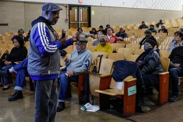 Calvin Williams talks about the 32 bus route with residents of Strawberry Mansion as they air grievances and ask questions of SEPTA officials about changes proposed to bus service in Philadelphia.