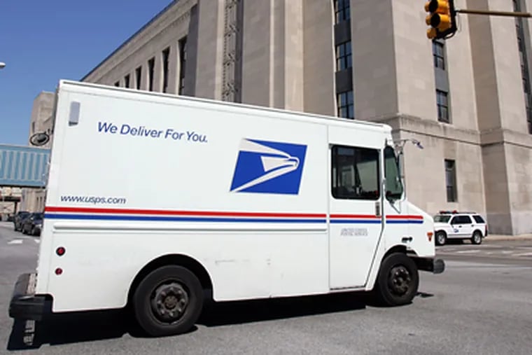 A U.S. Postal truck drives along Chestnut Street.  (David Swanson/Staff File Photo)
