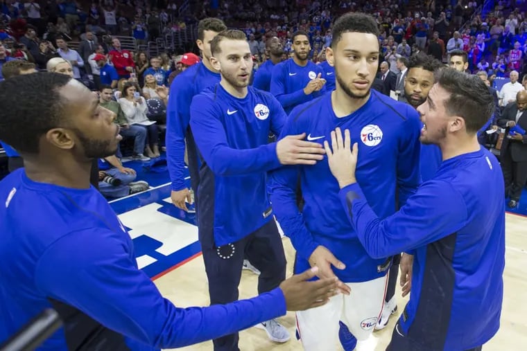Ben Simmons, center, is introduced as part of the Sixers starting lineup before the preseason game against the Memphis Grizzlies on Oct. 4.
