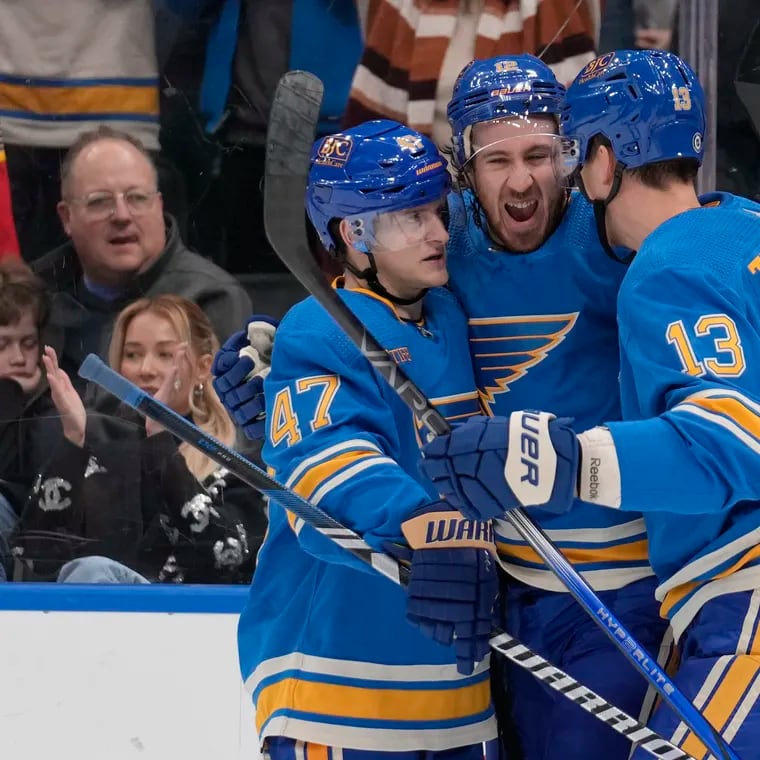 Kevin Hayes (center) celebrating a goal for the St. Louis Blues with Torey Krug (47) and Alexey Toropchenko on Dec. 16.