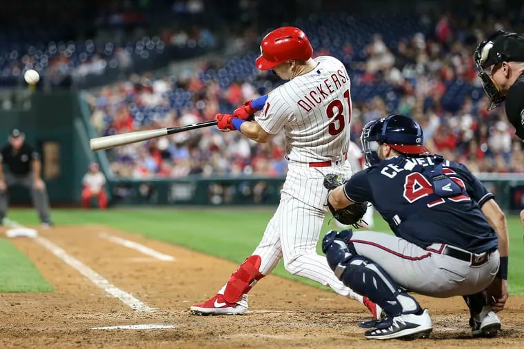 The Phillies' Corey Dickerson hits his second homer of the night against the Braves on Tuesday.