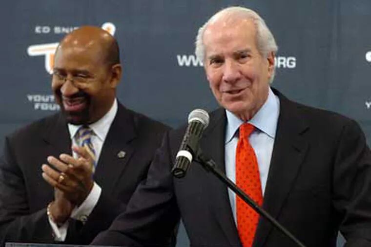 Ed Snider, left, speaks at a press conference in which he and Mayor Michael Nutter announced that the Ed Snider Youth Hockey Foundation will take over operation of three city ice rinks.  (Sarah J. Glover / Staff Photographer)
