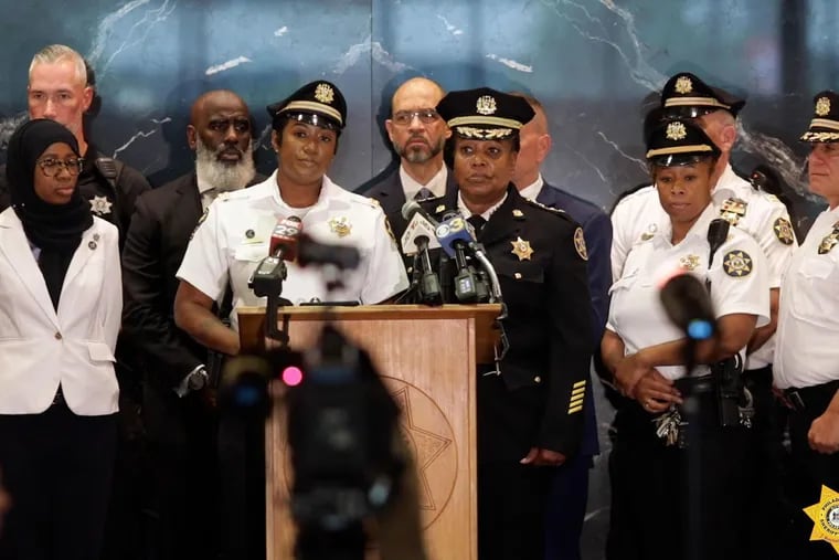At this July 2022 press conference about a warrant sweep, Undersheriff Tariq El-Shabazz (gray beard in background) stood alongside other law enforcement officials, including Philadelphia Sheriff Rochelle Bilal, Captain Nicole Nobles, of the Sheriff's Office, and Frank Vanore, of the Philadelphia Police Department. El-Shabazz, the second-in-command in the sheriff's office, was also handling criminal cases as a defense attorney.