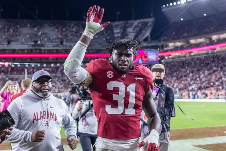 Alabama linebacker Will Anderson Jr. (31) waves to fans as he leaves the field after the team's win over Texas A&M in an NCAA college football game Saturday, Oct. 8, 2022, in Tuscaloosa, Ala.