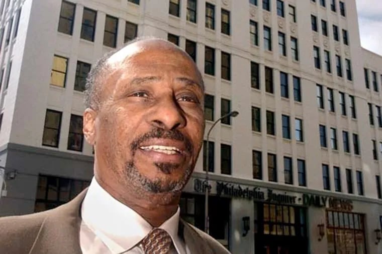Longtime Philadelphia Inquirer editor Acel Moore, seen outside the Inquirer building on June 2, 2005, has died.