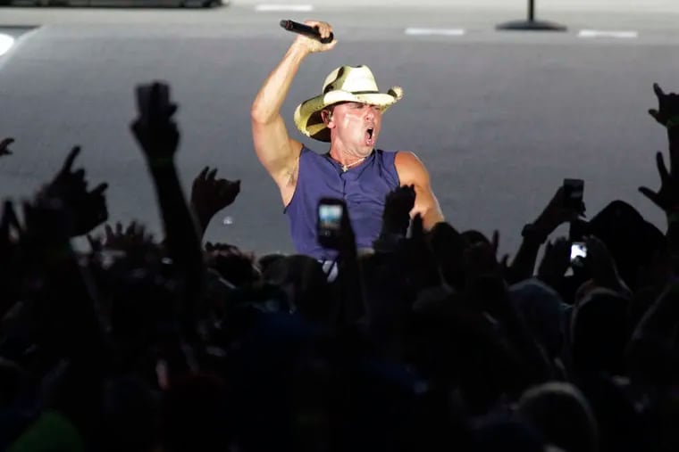 Country star Kenny Chesney performs at Lincoln Financial Field, part of his 17-stadium &quot;No Shoes Nation&quot; tour. Saturday's concert was Chesney's sixth visit to the Linc.