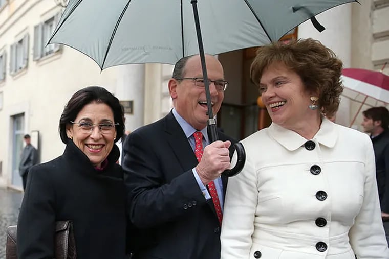 Jeanette Lerman-Neubauer, left,  and Joseph Neubauer, center, talk with Pennsylvania First Lady Susan Corbett, right, as they leave their hotel in Rome on March 24, 2014. ( DAVID MAIALETTI / Staff Photographer )