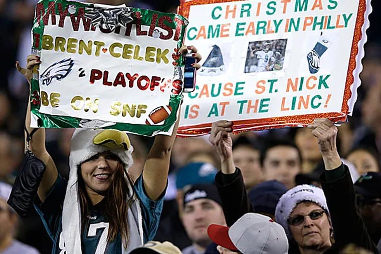 Eagles fans hold up a sign. (Michael Perez/AP)