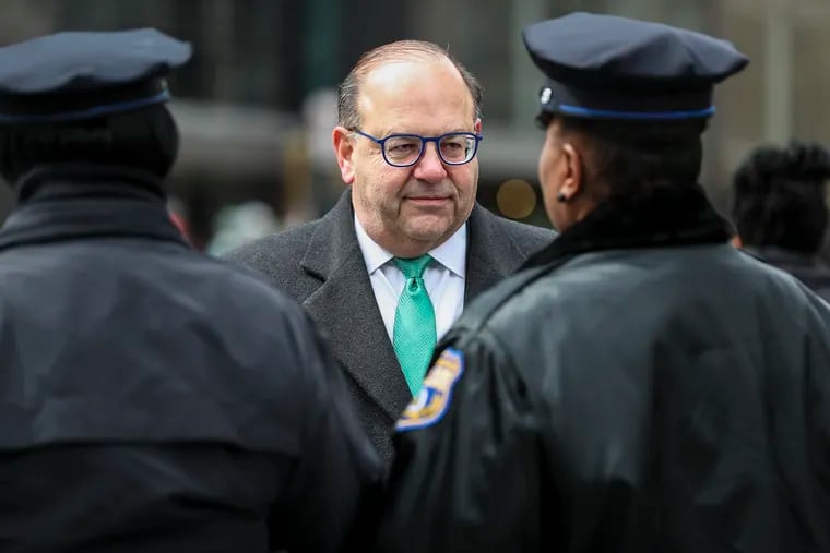 Mayoral Candidate Allan Domb talks with Philadelphia police officers during the St. Patrick’s Day Parade on March 12.