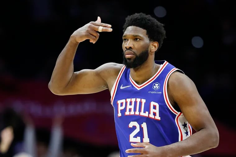 Sixers center Joel Embiid gestures after making a three-point basket during the fourth quarter against the Sacramento Kings on Saturday, January 29, 2022 in Philadelphia.