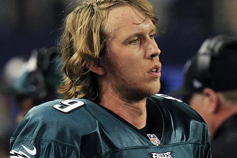 Philadelphia Eagles quarterback Nick Foles (9) watches action against
the Dallas Cowboys during the second half of an NFL football game
Sunday, Dec. 2, 2012 in Arlington, Texas. Dallas won 38-33. (AP
Photo/LM Otero)