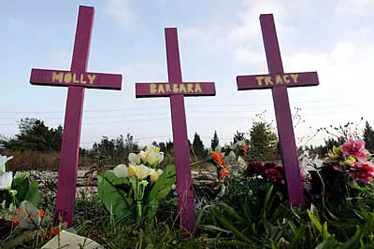 File photo of three crosses not far from the area where four prostitutes were found slain Nov. 20, 2006. Molly Jean Dilts, Barbara Breidor, Tracy Ann Roberts, and Kim Raffo were killed. (AP)