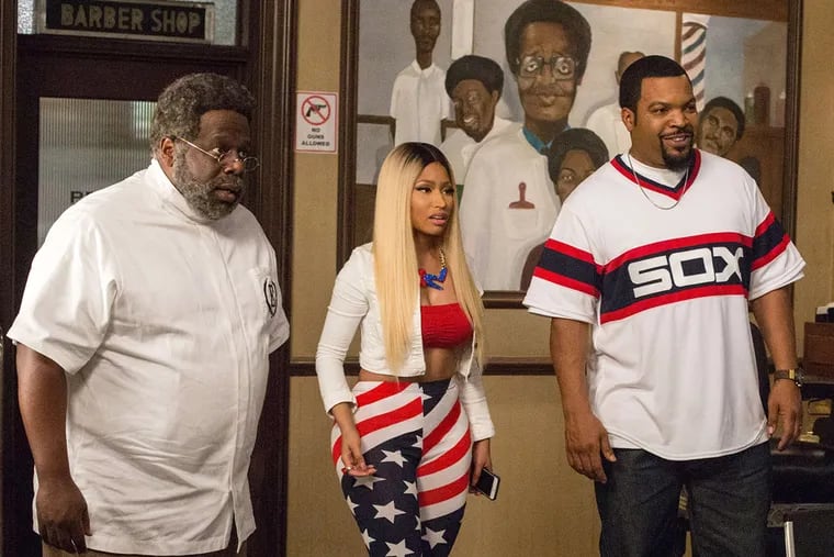 Cedric The Entertainer, from left, Nicki Minaj and Ice Cube appear in a scene from "Barbershop: The Next Cut."
