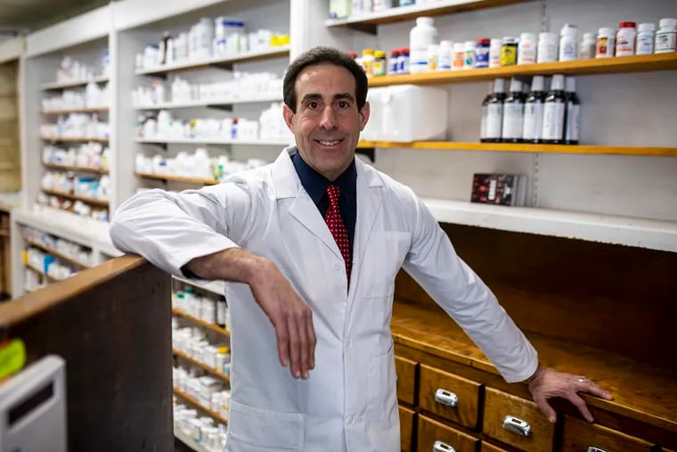 Pharmacist in charge, Tony Minniti, poses for a portrait inside Bell Rexall Pharmacy on Wednesday, Jan. 13, 2021.