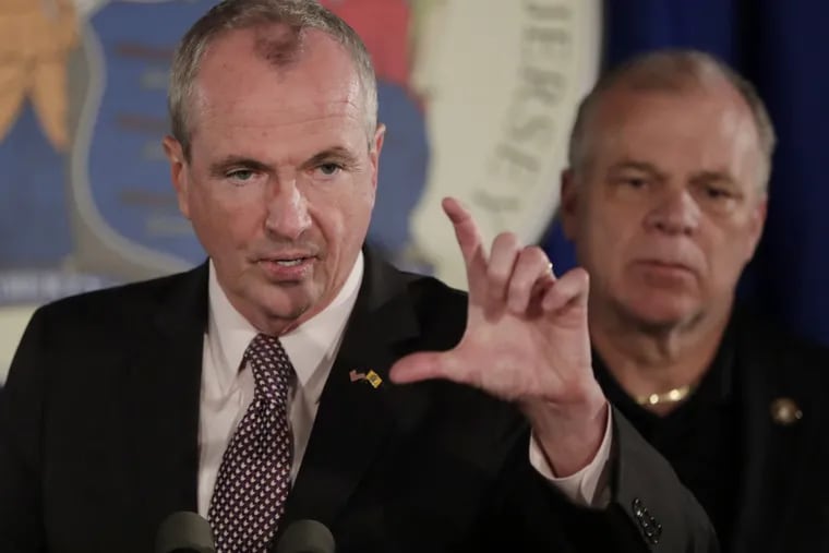 New Jersey Gov. Phil Murphy, left, with State Sen. Steve Sweeney, D-West Deptford. The state's top Democrats have struggled over spending and taxes, but reached a deal on a plan to separate the state's relatively well-funded local police and fire pension plan from its underfunded state workers' and teachers' plans.