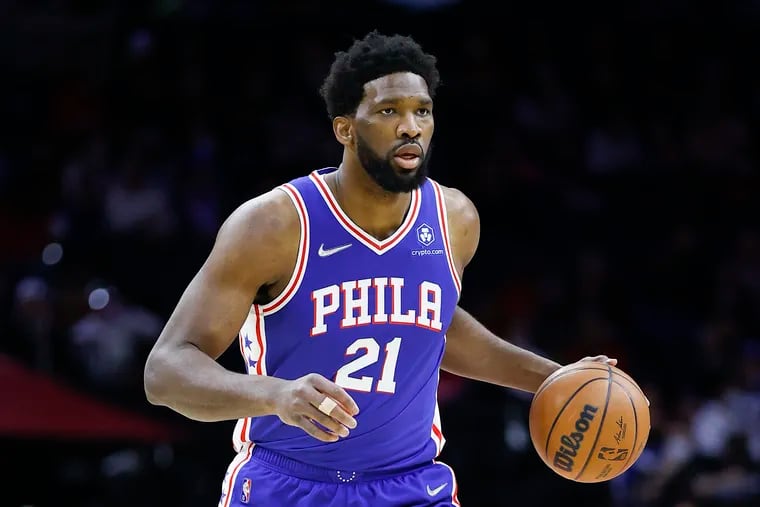 Sixers center Joel Embiid dribbles the basketball against the Sacramento Kings on Saturday, January 29, 2022 in Philadelphia.