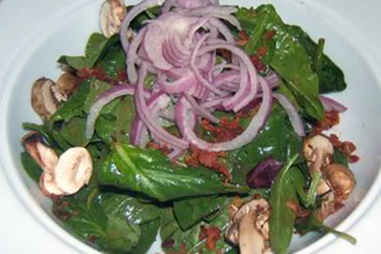 Spinach salad was smoky with bacon and tart with vinaigrette, but the button mushrooms were past their prime.