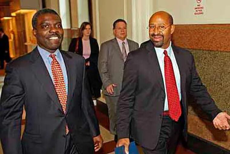 Mayor Nutter (right) and his chief of staff, Clarence Armbrister, were all smiles walking down a hallway in city hall in this 2007 file photo. (Gerald S. Williams / Staff Photographer)