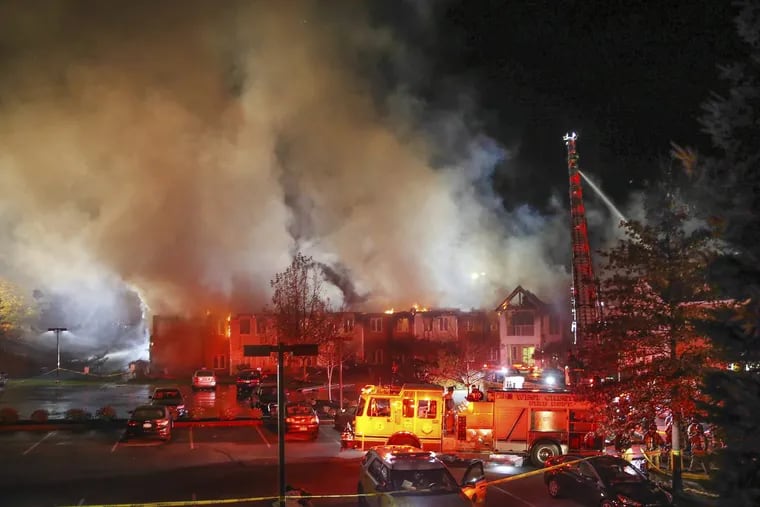 Firefighters battle a four-alarm blaze at the Barclay Friends nursing home in West Chester on Nov. 16.