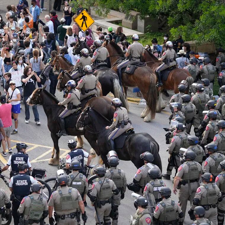 State troopers try to break up a pro-Palestinian protest at the University of Texas on Wednesday in Austin, Texas.