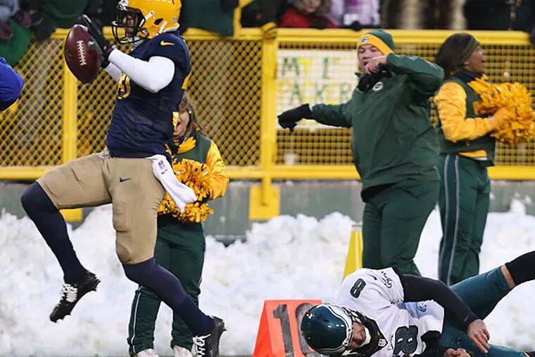 The Packers' Micah Hyde dances into the end zone as Donnie Jones dives for him. (David Maialetti/Staff Photographer)