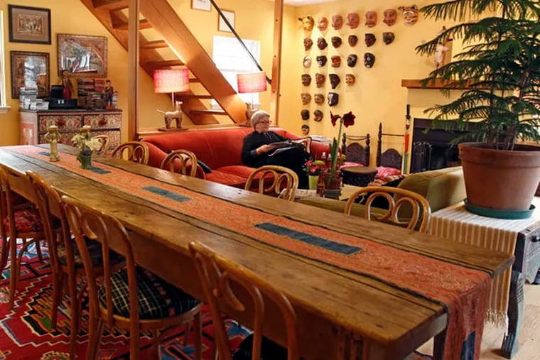The first-floor family room with a dining area with English counter from a table. The home of Helen Cunningham and Ted Newbold in Old City with Latin American folk art. ( Michael Bryant / Staff Photographer )