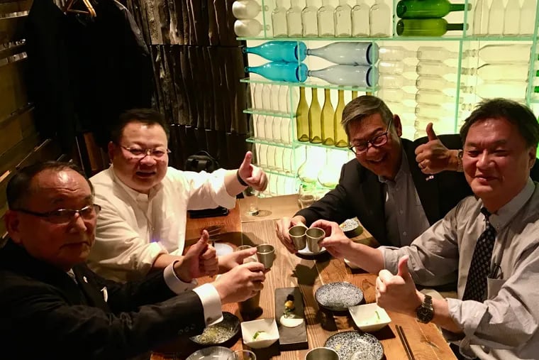 Members and advisers of a precedent-setting slate of insurgent candidates challenging the management-backed incumbent board for control of Sekisui House, the Japan-based homebuilder, meet in Japan on Feb. 14. From left: board candidate Jiro Iwasaki, an electronics executive; lawyers Shikun Gao and William Uchimoto, who are advising the insurgents; and board candidate Fumiyasi Seguro, head of Sekisui's International Division.