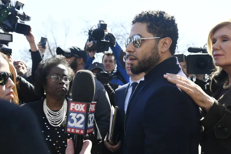 Actor Jussie Smollett talks with the media while leaving Cook County Court after his charges were dropped Tuesday, March 26, 2019, in Chicago.