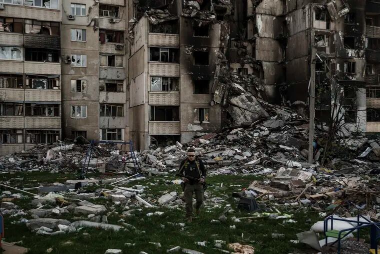 A Ukrainian serviceman walking amid the rubble of a building heavily damaged by multiple Russian bombardments near a frontline in Kharkiv, Ukraine, on Monday.