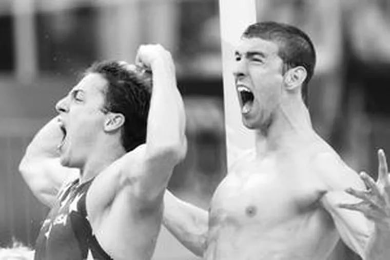 MICHAEL PHELPS (right) and Garret Weber-Gale celebrate as their team wins the gold in the men&#0039;s 4x100-meter freestyle relay. Phelps was recently spotted in Beijing making out with the triple gold medal-winning Australian swimmer Stephanie Rice.