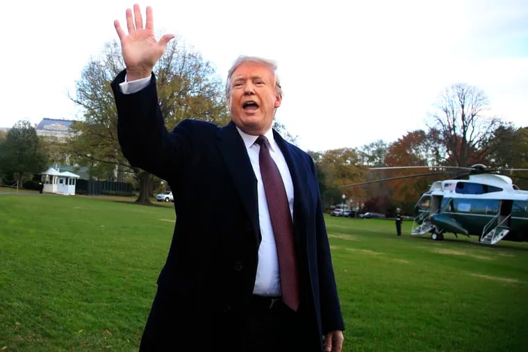 President Trump waves after speaking to the media before leaving the White House in Washington, Tuesday, Nov. 20, 2018, to travel to Florida, where he will spend Thanksgiving at Mar-a-Lago.