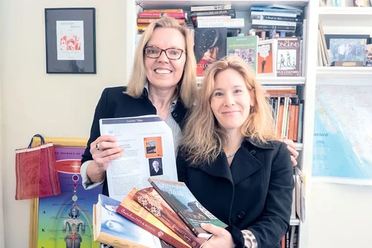 Joy Stocke, left, and Kim Nagy, co-founders and co-owners of Wild River Consulting and Publishing, in their Stockton, N.J., office. (ED HILLE / Staff
Photographer )