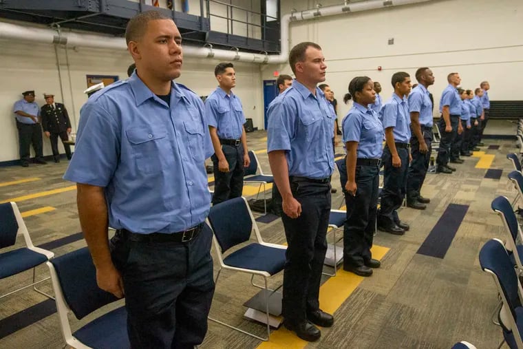 Recruits stand at attention before being addressed by Commissioner Danielle Outlaw at the Philadelphia Police Academy Training in July 2021.