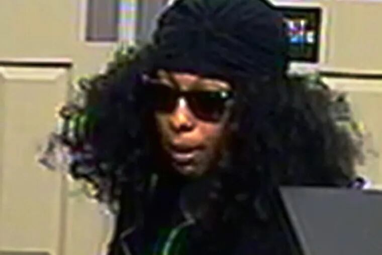 A surveillance still of a suspect in the robbery of a Bank of America branch in Conshohocken.