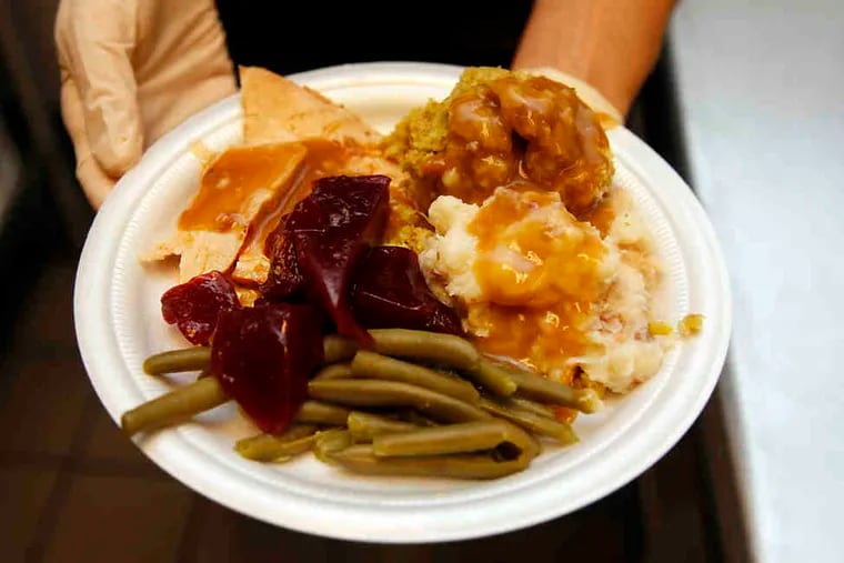 The traditional Thanksgiving meal at the Cathedral Kitchen included turkey, stuffing, potatoes, and cranberry sauce.