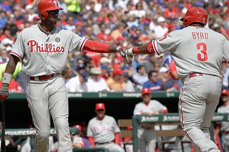 The Phillies' Marlon Byrd celebrates his home run with Domonic Brown during the sixth inning.  (Tony Gutierrez/AP)