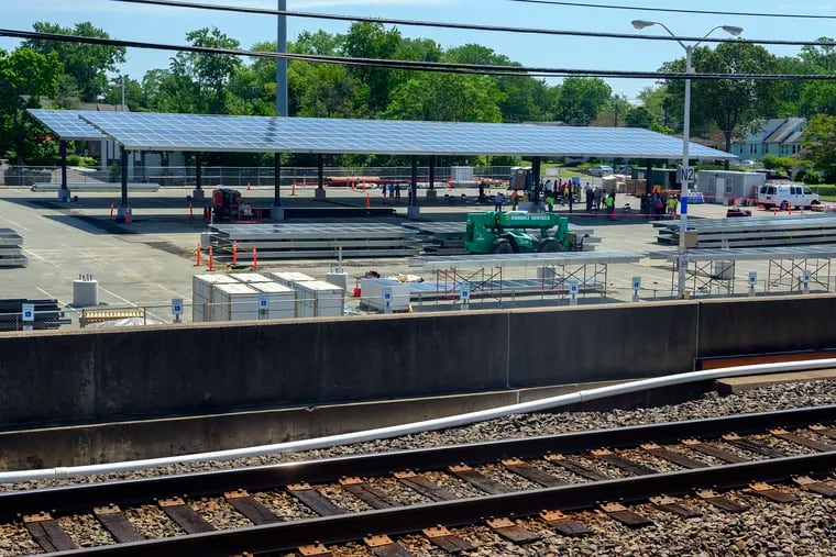 Solar panels can be seen from the train platform after a press conference announcing the DRPA and PATCO's clean energy initiative, at the PATCO Ashland Station in Voorhees.