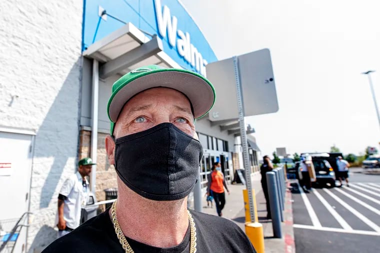Steve Mullins of South Philadelphia wears a face mask outside of Walmart in August.
